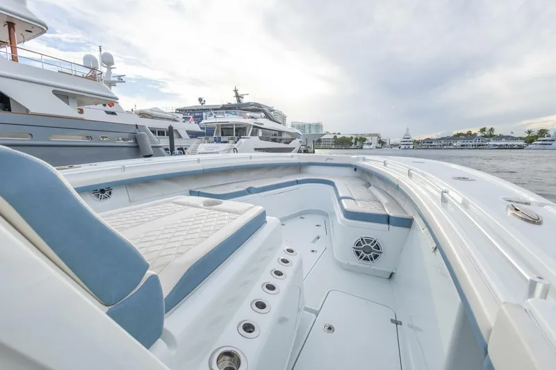 Rule #1 Yacht Photos Pics 2023 Yellowfin 42 Offshore boat interior with luxurious seating and waterfront view.