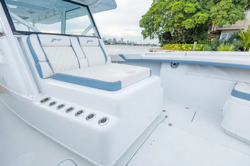 Rule #1 Yacht Photos Pics 2023 Yellowfin 42 Offshore boat interior with cushioned seating and sleek design.