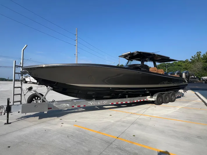  Yacht Photos Pics 2026 Nor-Tech 400 Supersport boat on trailer, parked in sunny lot.