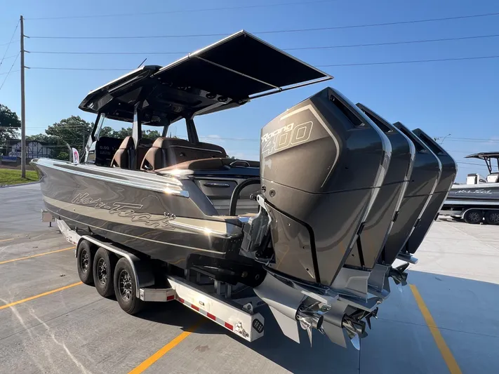  Yacht Photos Pics 2026 Nor-Tech 400 Supersport boat with triple outboard engines on a trailer.