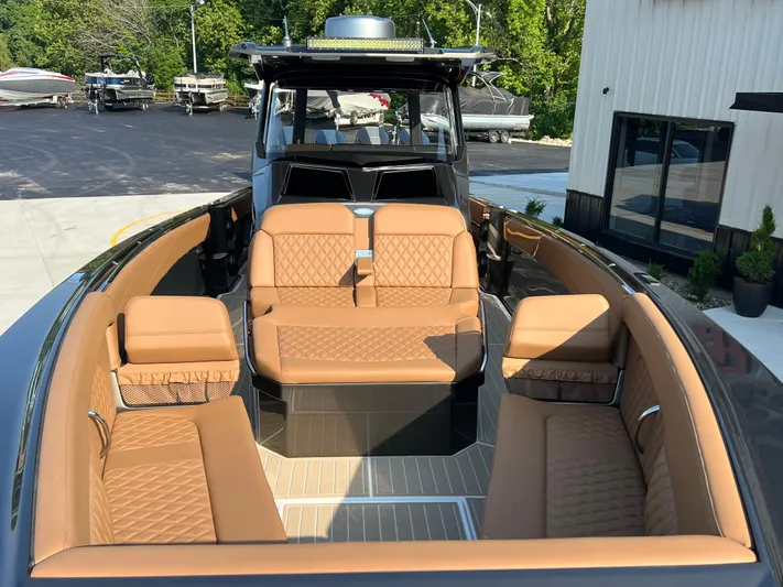  Yacht Photos Pics 2026 Nor-Tech 400 Supersport boat with luxurious tan seating and sleek design.