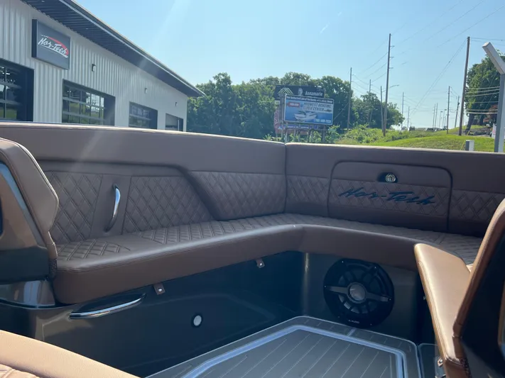  Yacht Photos Pics Interior of 2026 Nor-Tech 400 Supersport boat with brown quilted seating.