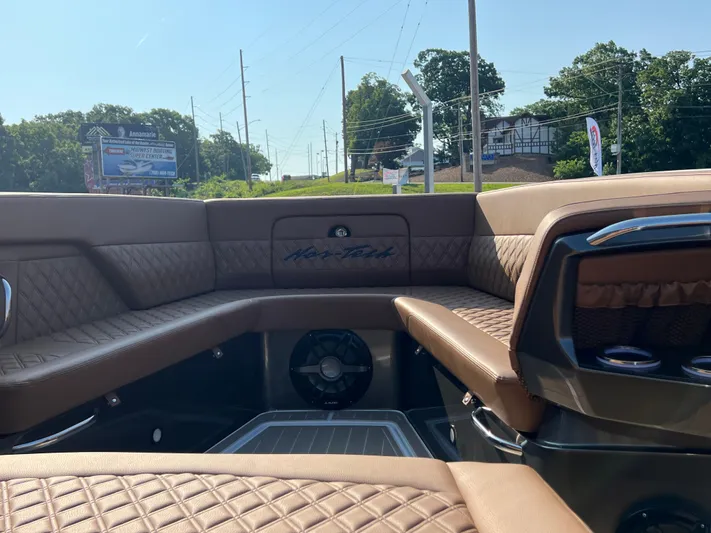  Yacht Photos Pics Luxurious interior of 2026 Nor-Tech 400 Supersport boat with brown leather seating.