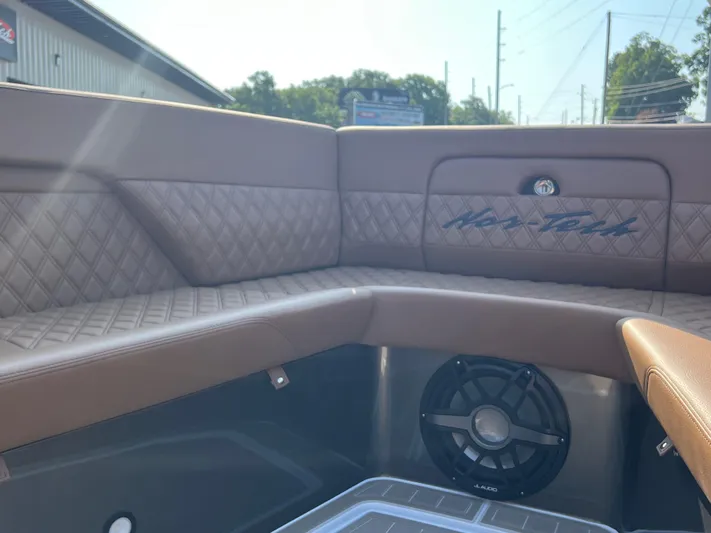  Yacht Photos Pics Luxurious interior of 2026 Nor-Tech 400 Supersport boat with brown quilted seating.