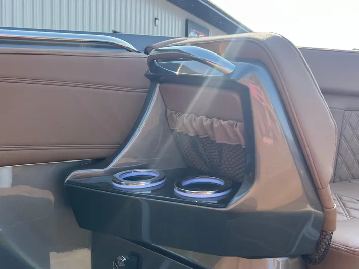  Yacht Photos Pics 2026 Nor-Tech 400 Supersport interior with cup holders and brown leather seating.