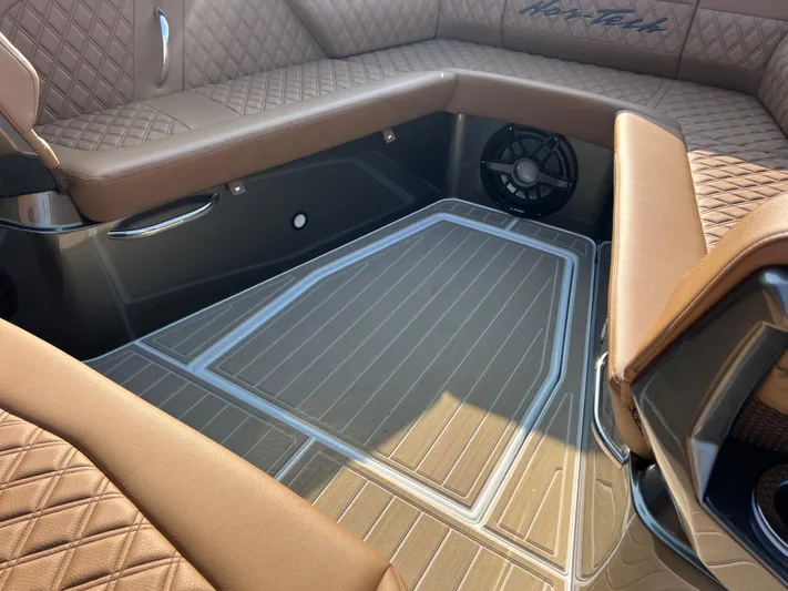  Yacht Photos Pics Luxurious interior of 2026 Nor-Tech 400 Supersport boat with quilted seating and sleek flooring.