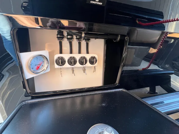  Yacht Photos Pics Control panel of 2026 Nor-Tech 400 Supersport boat with gauges and switches.