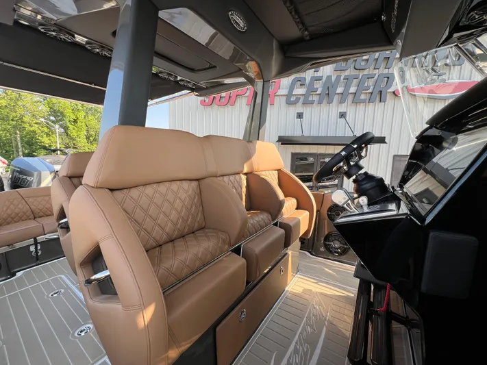  Yacht Photos Pics Luxurious interior of 2026 Nor-Tech 400 Supersport boat with tan leather seating.