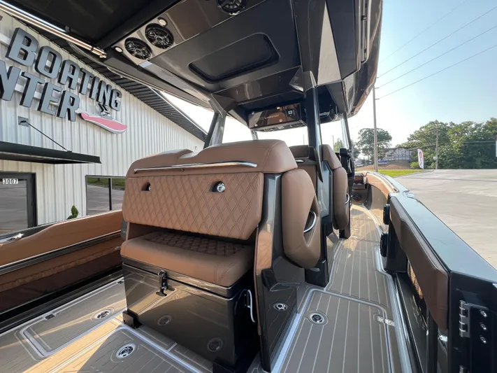  Yacht Photos Pics 2026 Nor-Tech 400 Supersport boat interior with luxurious seating at a boating center.