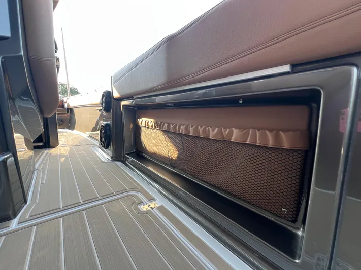  Yacht Photos Pics 2026 Nor-Tech 400 Supersport interior with brown seating and storage compartment.