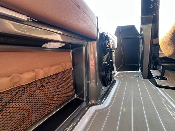  Yacht Photos Pics Interior view of 2026 Nor-Tech 400 Supersport boat, featuring seating and storage compartments.