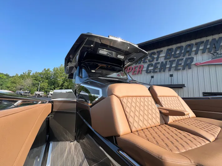  Yacht Photos Pics 2026 Nor-Tech 400 Supersport boat with luxurious tan seating at a boating center.
