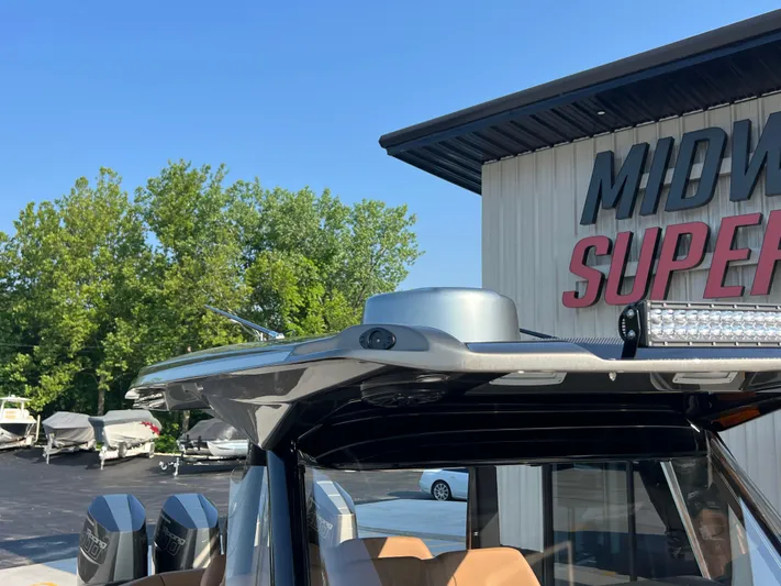  Yacht Photos Pics 2026 Nor-Tech 400 Supersport boat at dealership, featuring sleek design and powerful engines.