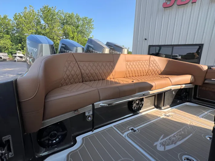  Yacht Photos Pics Luxurious seating on 2026 Nor-Tech 400 Supersport boat, featuring tan leather upholstery and sleek design.