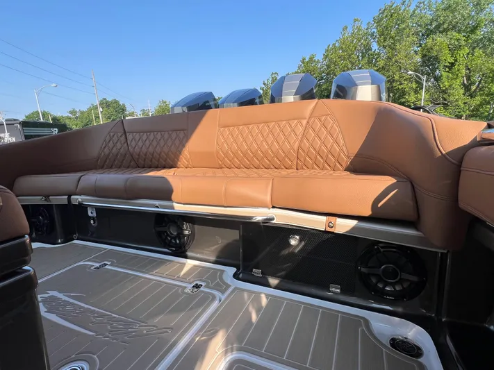  Yacht Photos Pics Luxurious brown leather seating on 2026 Nor-Tech 400 Supersport boat, featuring modern design elements.