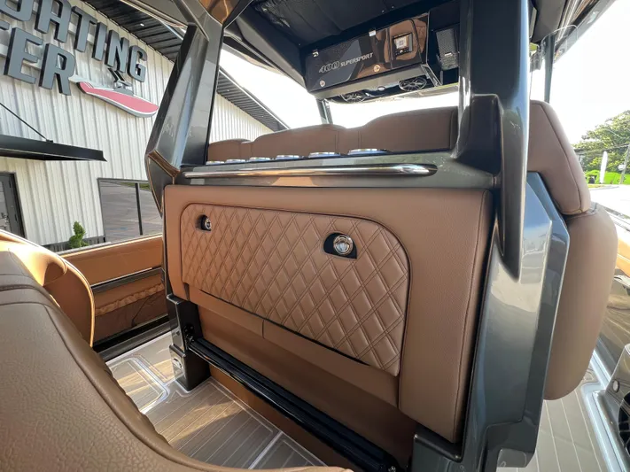  Yacht Photos Pics 2026 Nor-Tech 400 Supersport interior with luxurious brown leather and modern design elements.