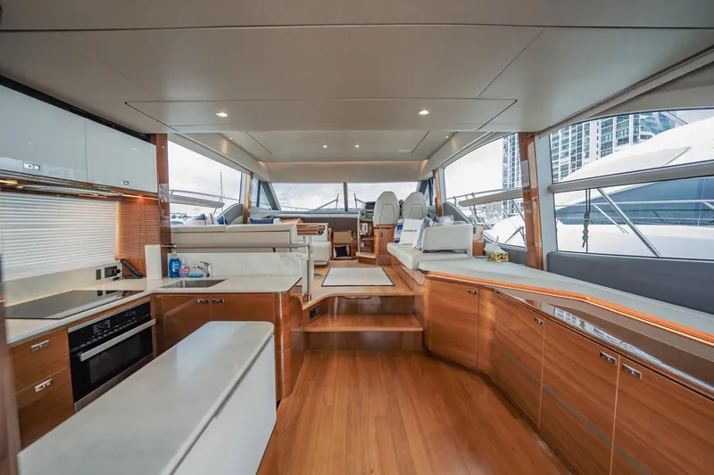 Endeavor Yacht Photos Pics Luxurious interior of 2019 Princess F55 yacht with modern kitchen and seating area.