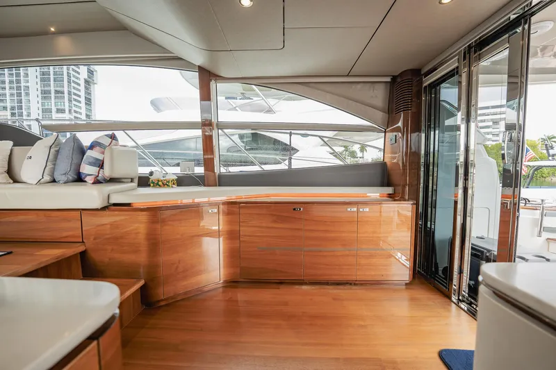 Endeavor Yacht Photos Pics Luxurious interior of 2019 Princess F55 yacht with wooden cabinetry and plush seating.