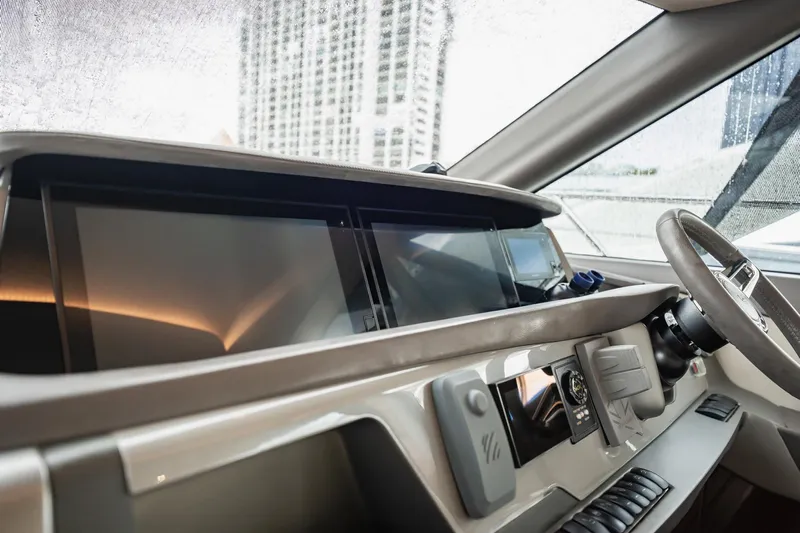 Endeavor Yacht Photos Pics Interior view of 2019 Princess F55 yacht dashboard with modern controls and displays.