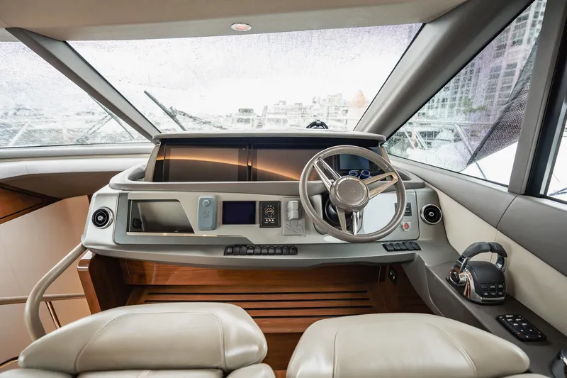 Endeavor Yacht Photos Pics Luxurious 2019 Princess F55 yacht helm with modern controls and panoramic view.
