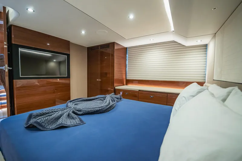Endeavor Yacht Photos Pics Luxurious 2019 Princess F55 yacht bedroom with modern decor and ambient lighting.