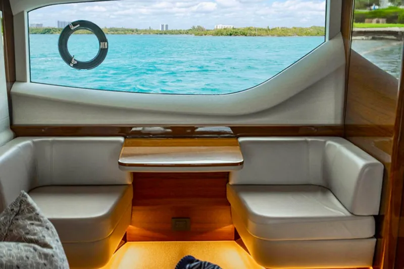 Endeavor Yacht Photos Pics Luxurious interior of 2019 Princess F55 yacht with ocean view through window.