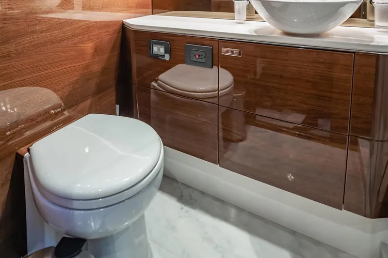 Endeavor Yacht Photos Pics Luxurious bathroom in 2019 Princess F55 yacht with modern fixtures and wood finish.