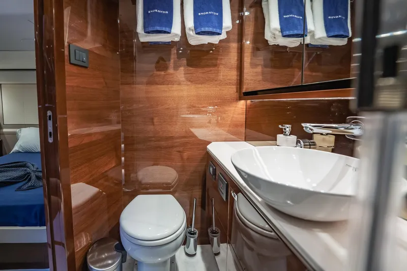 Endeavor Yacht Photos Pics Luxurious bathroom in 2019 Princess F55 yacht with modern fixtures and wooden accents.