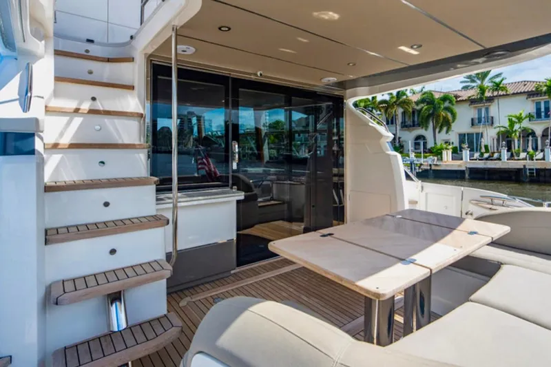Endeavor Yacht Photos Pics Luxurious 2019 Princess F55 yacht interior with elegant seating and staircase.