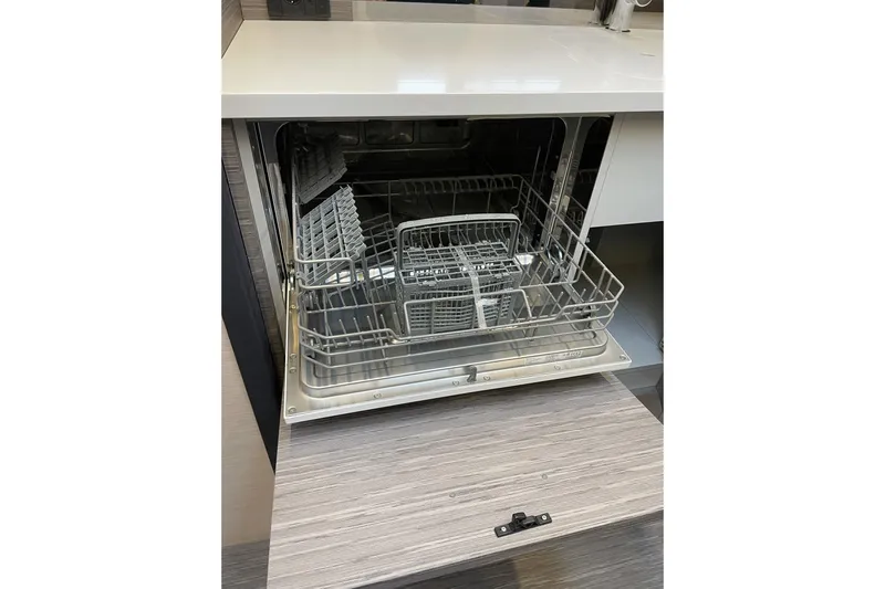 Dena Yacht Photos Pics Open Airon Cinquanta 50 dishwasher, 2021 model, with empty racks and modern design.