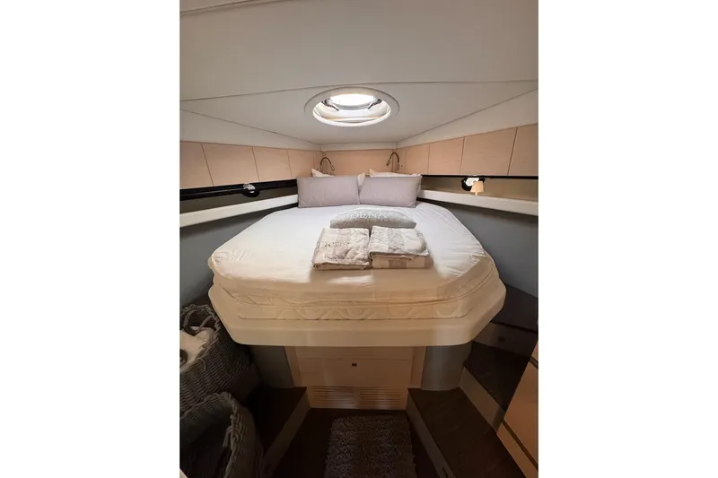 Dena Yacht Photos Pics Luxurious cabin interior of 2021 Airon Cinquanta 50 yacht with cozy bed and modern design.