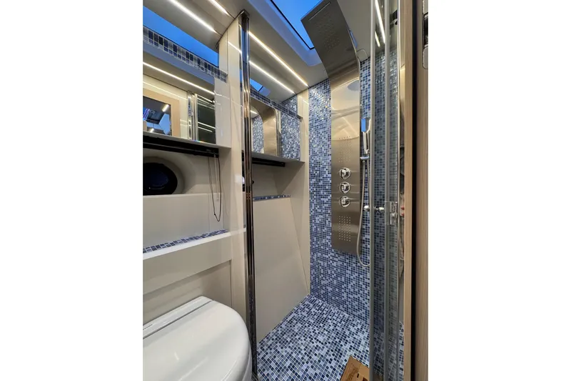 Dena Yacht Photos Pics Luxurious bathroom in 2021 Airon Cinquanta 50 yacht with modern shower and sleek design.