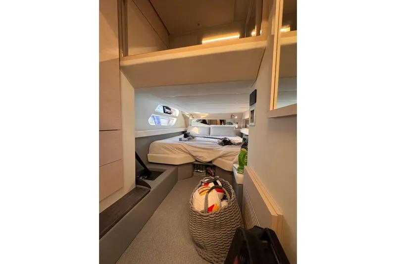 Dena Yacht Photos Pics Interior of 2021 Airon Cinquanta 50 yacht cabin with bed and modern decor.