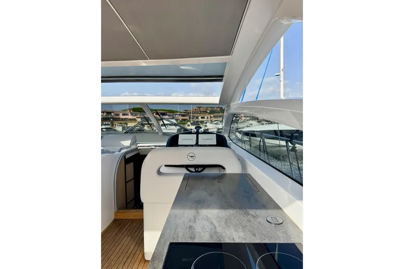Dena Yacht Photos Pics 2021 Airon Cinquanta 50 yacht interior with modern helm and sleek design.