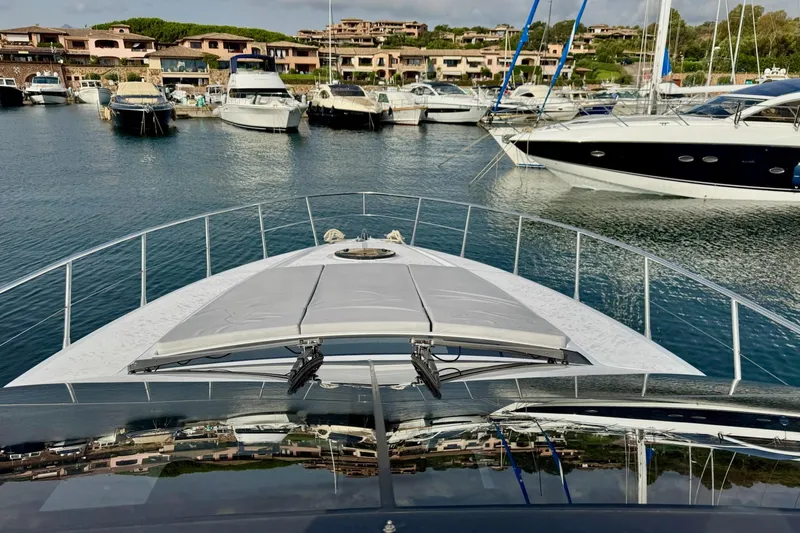 Dena Yacht Photos Pics Bow view of 2021 Airon Cinquanta 50 yacht in a marina with other boats.
