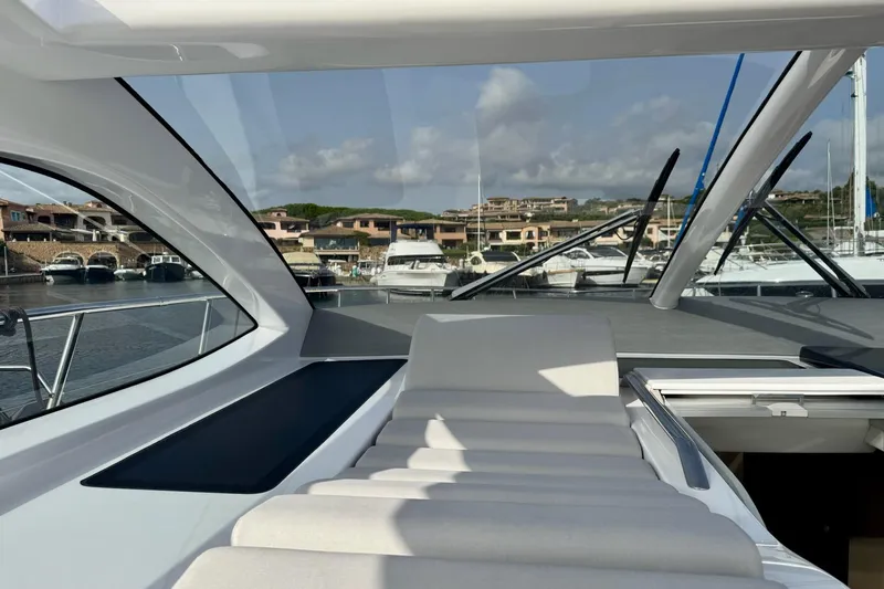 Dena Yacht Photos Pics Luxury Airon Cinquanta 50 yacht interior, 2021 model, docked at marina with scenic view.