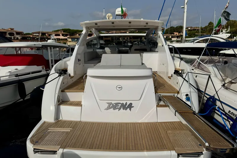 Dena Yacht Photos Pics 2021 Airon Cinquanta 50 yacht docked, featuring spacious deck and modern design.