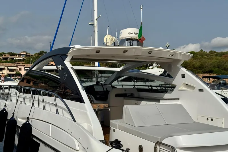 Dena Yacht Photos Pics Luxury Airon Cinquanta 50 yacht, 2021 model, docked in a marina under clear skies.