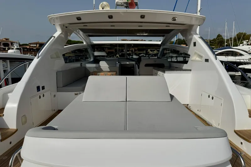 Dena Yacht Photos Pics 2021 Airon Cinquanta 50 yacht with spacious deck and modern design in marina setting.