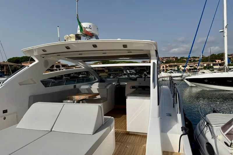 Dena Yacht Photos Pics Luxury Airon Cinquanta 50 yacht, 2021 model, docked in a scenic marina.