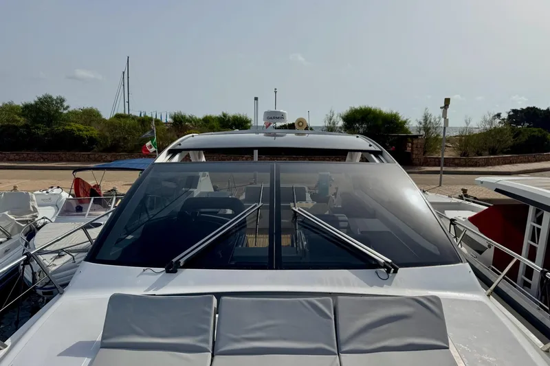 Dena Yacht Photos Pics 2021 Airon Cinquanta 50 yacht docked, featuring sleek design and spacious deck.