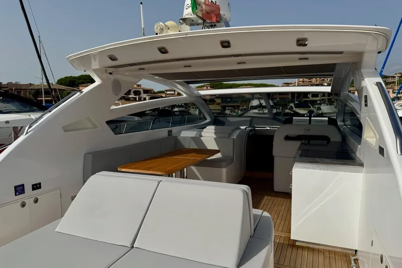 Dena Yacht Photos Pics Luxurious 2021 Airon Cinquanta 50 yacht interior with seating and dining area.