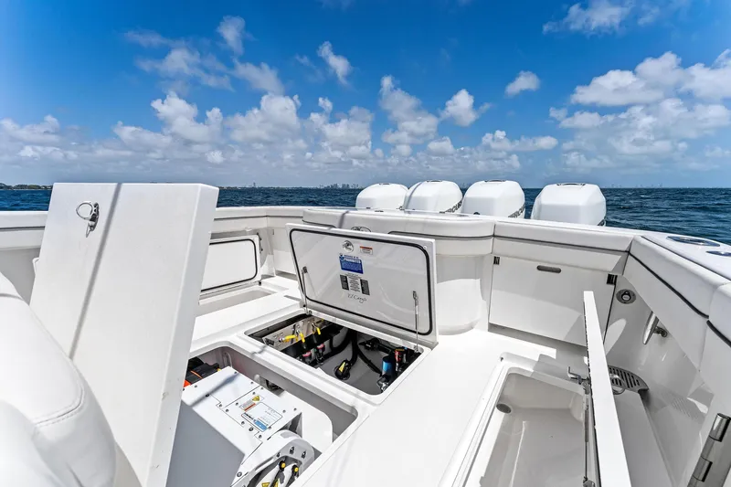 Engine Warranty X Seakeeper Yacht Photos Pics 2021 Valhalla Boatworks V-41 with open storage compartments, ocean view, and clear blue sky.