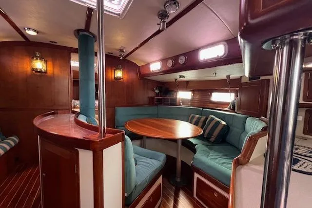 Tumblehome Yacht Photos Pics Interior of 1995 Little Harbor 51 Pilothouse with cozy seating and wooden accents.