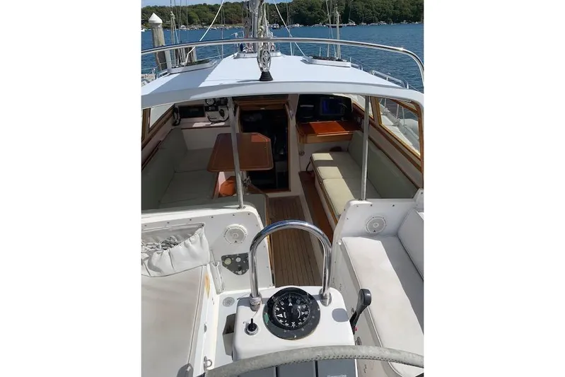 Tumblehome Yacht Photos Pics 1995 Little Harbor 51 Pilothouse interior with seating and navigation equipment.