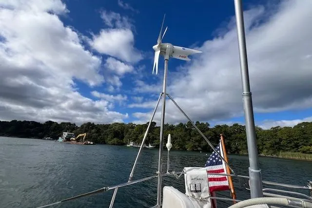 Tumblehome Yacht Photos Pics Sailboat with wind turbine on water, Little Harbor 51 Pilothouse, 1995 model.