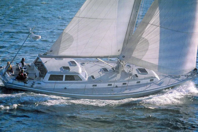 Tumblehome Yacht Photos Pics Sailing yacht Little Harbor 51 Pilothouse, 1995 model, cruising on open water.
