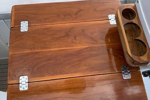 Tumblehome Yacht Photos Pics Polished wooden surface with hinges on a 1999 Little Harbor 51 Pilothouse yacht.