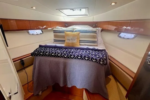 Stay Loose Yacht Photos Pics Luxurious cabin interior of 2013 Sea Ray 410 Sundancer yacht with cozy bedding.