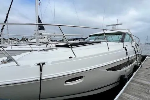 Stay Loose Yacht Photos Pics 2013 Sea Ray 410 Sundancer yacht docked at marina under cloudy sky.